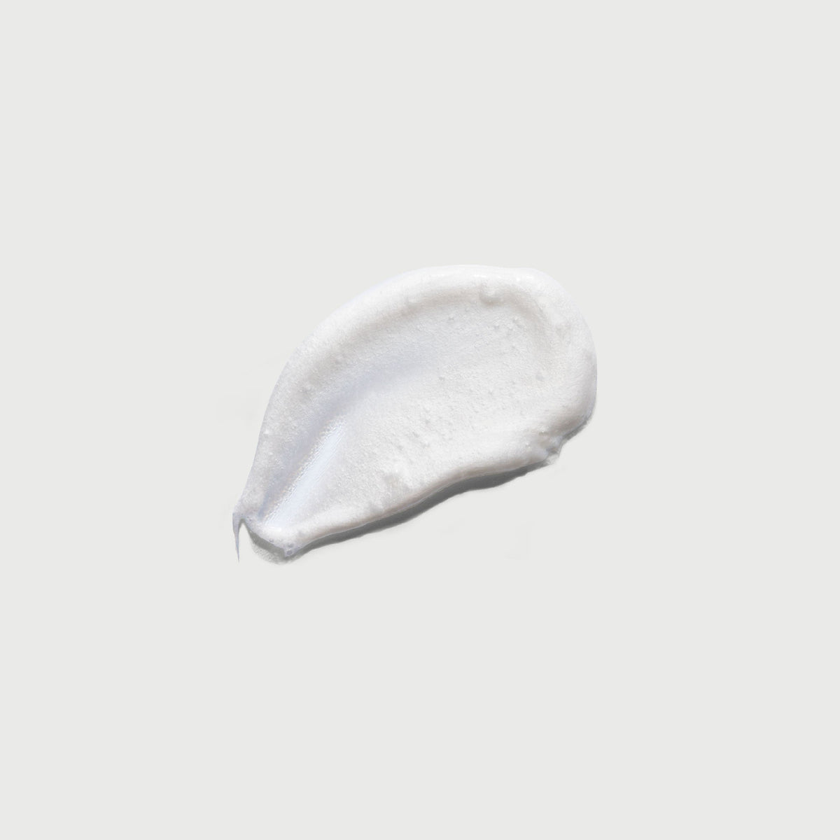 the-smoother-glycolic-acid-exfoliating-body-wash-u1 NATR-40002-Swatch-The-Smoother-Glycolic-Acid-Exfoliating-Body-Wash-bonebkgd.jpg